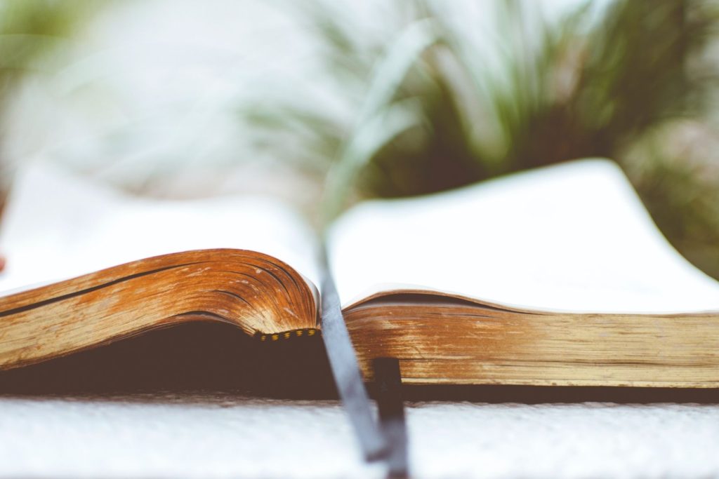 Photo of open book with ribbon bookmark